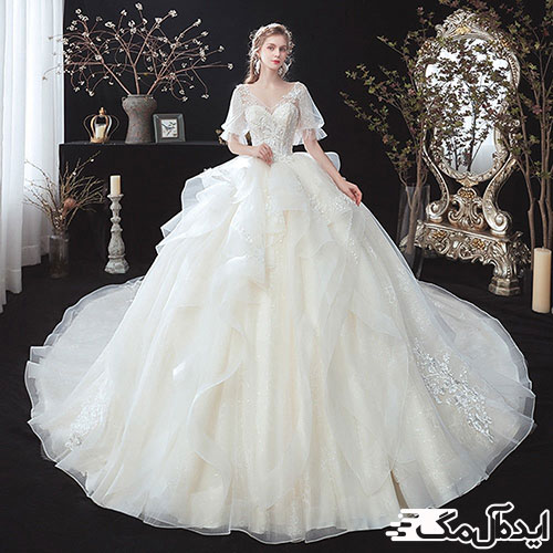 لباس عروس پرنسسی زیبا با آستین‌های تور کوتاه