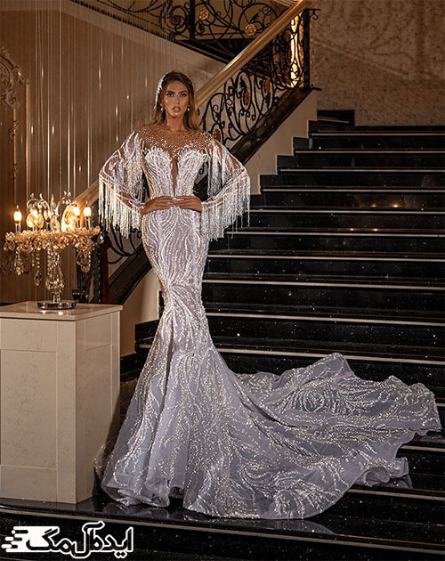 استفاده از پارچه زیبای شاین‌دار و طراحی زیبای آستین‌ها و یقه در لباس عروس اروپایی 2022