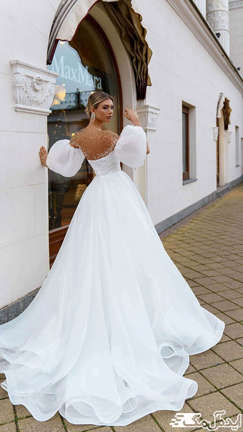 لباس عروس دکلته پشت‌بلند با آستین‌های پفی