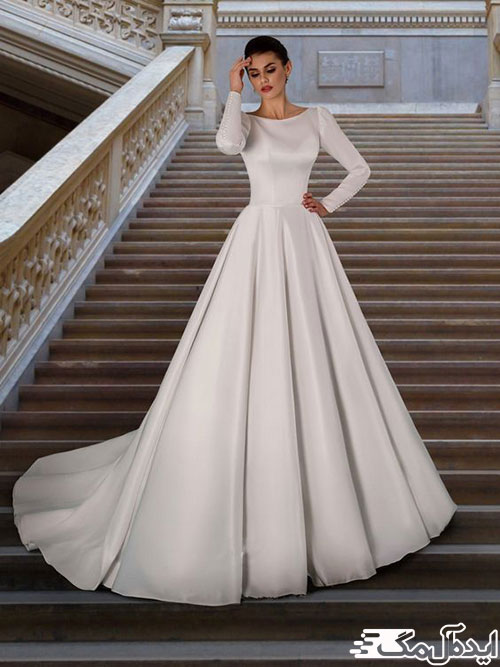 مدل نیمه‌پفی و استفاده از پارچه ساده یکدست ساتن در لباس عروس پوشیده به سبک اروپایی