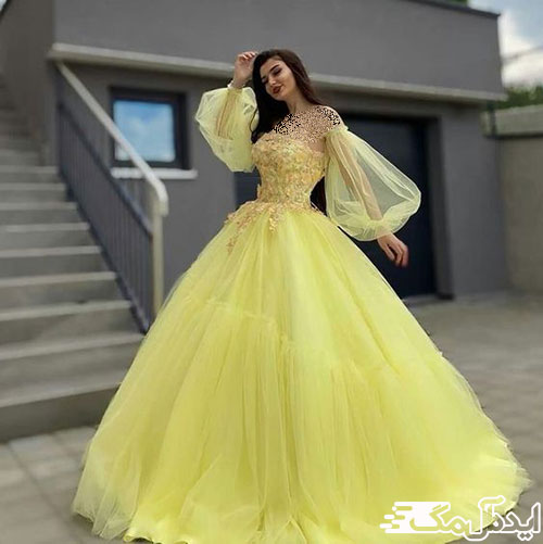 طرحی زیبا از لباس نامزدی پرنسسی به رنگ لیمویی با آستین‌های پفی تور