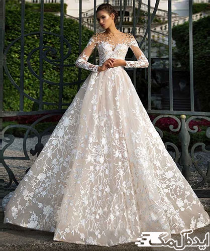 دامن نیمه‌پفی و آستین‌های زیبا و بلند دانتل در یک طراحی زیبا و چشم‌نواز برای لباس عروس