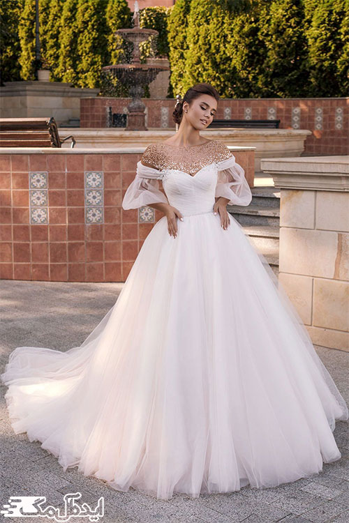 آستین‌های پفی تور و سرشانه‌های افتاده در لباس عروس 2022